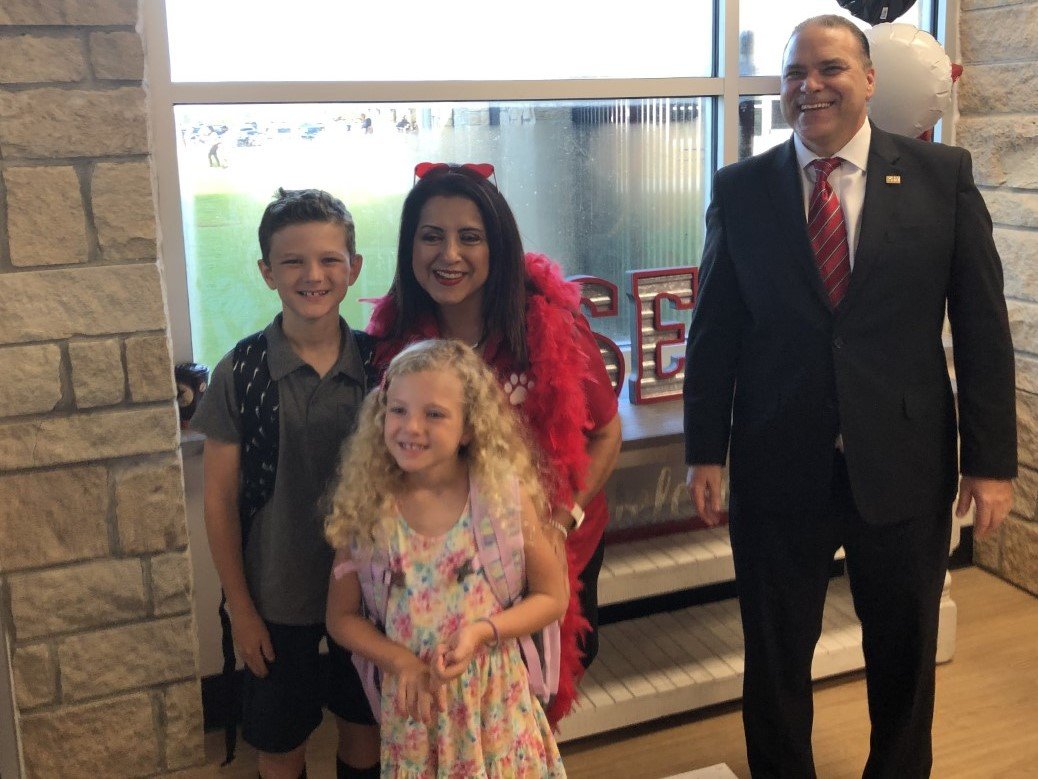 Robertson Elementary principal Martha Pulido poses with two students on the first day at new school. Katy ISD Superintendent Ken Gregorski stands at right.